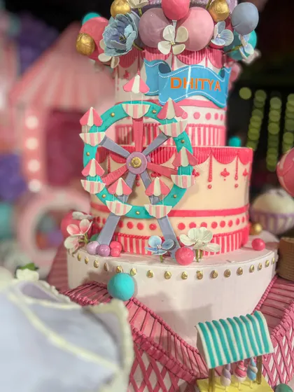 A closer look at the incredible detail on the carnival cake, including a tiny, edible ferris wheel and delicate banner.