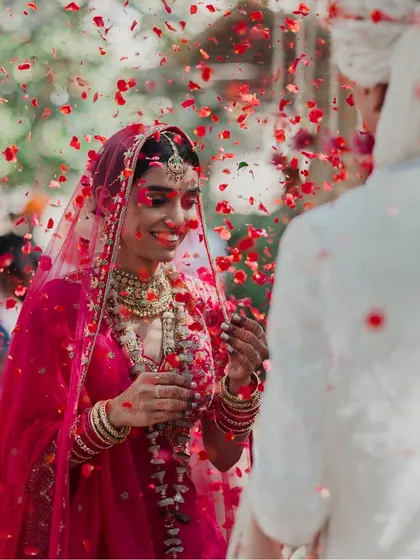 A beautiful moment of the bride during the 'varmala' or garland exchange ceremony.