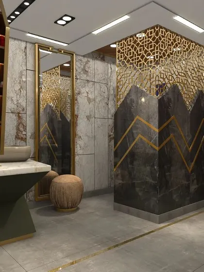 A view of one of the twin vanities, showcasing the geometric base, marble top, and a large mirror that enhances the room's brightness.