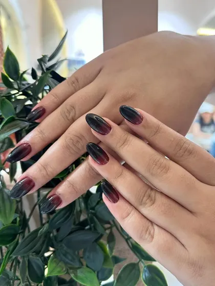 A stunning ombré look, fading from a deep black to a rich burgundy. It's dramatic, sophisticated, and perfect for a bold statement.