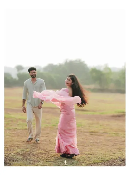 A beautiful, candid shot of her twirling in her pink saree. The movement and joy in this image are what I strive to capture.