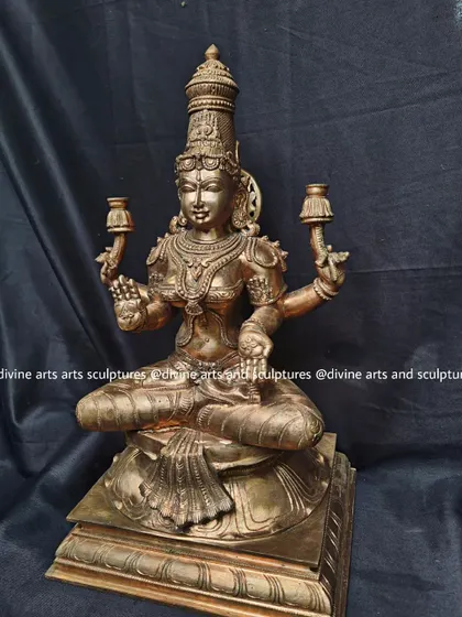 An authentic handmade bronze Lakshmi icon. The rich, warm glow of the polished bronze enhances her divine presence as the goddess of fortune.