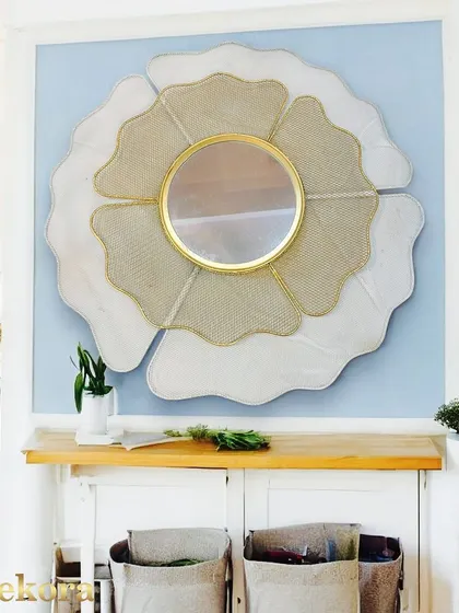This stylish big wall decor mirror makes a bold statement with its unconventional shape and mixed materials.