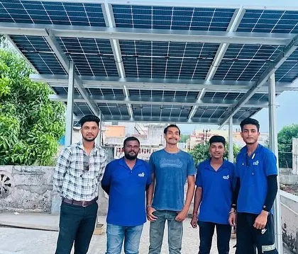 A customer with our installation team on his rooftop, all smiles after a successful project completion.