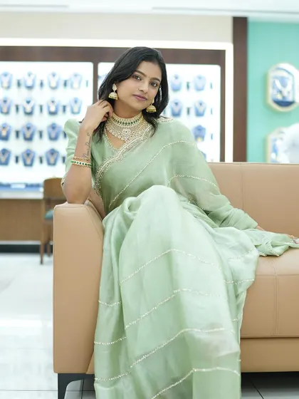 Another shot of Sonu looking elegant and poised while seated.