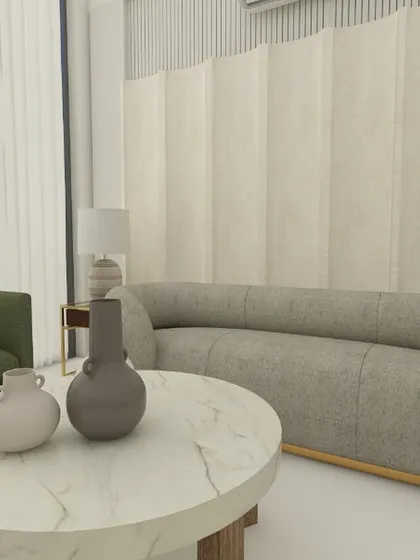 This view highlights the layered coffee tables and the overall calm, neutral color palette of the living room, accented with olive green chairs.
