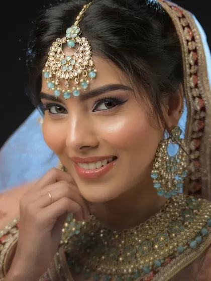 A happy, smiling bride. I teach my students to create makeup that not only looks good but also feels comfortable and allows the bride's personality to shine through.