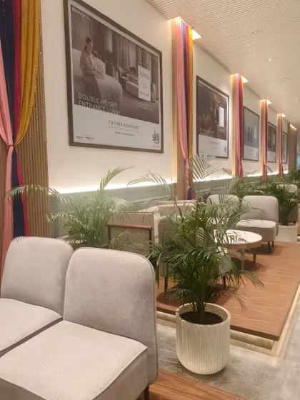 Simple yet elegant festive decor in a lobby for Navratri. We used colorful drapes in pink, yellow, and blue to add a touch of celebration to the space.