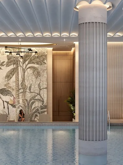 A view of the Nagpur poolside, highlighted by a stunning mosaic art wall depicting tropical birds. This detail showcases our impeccable attention to creating a unique and sophisticated atmosphere for relaxation.