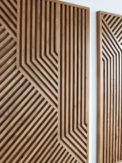 A set of two chic wooden art panels with a continuous geometric design. The vertical and diagonal lines create a visually engaging and sophisticated look.