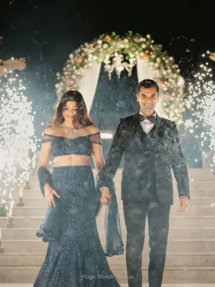 A grand entrance for the couple, walking through a path of cold pyrotechnics for a dramatic and celebratory start to their reception.
