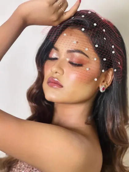 The glossy, sun-kissed makeup with heavy blush and a shimmery eye.