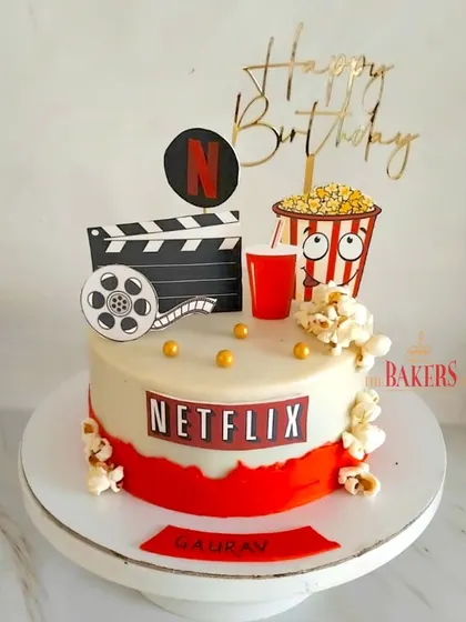 For the love of Netflix! This fun, no-fondant cake is perfect for a movie night or for someone who loves to binge-watch their favorite shows. It features popcorn, a drink, and the iconic Netflix logo.