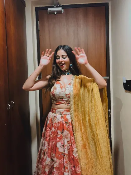 A playful moment captured in the floral lehenga.