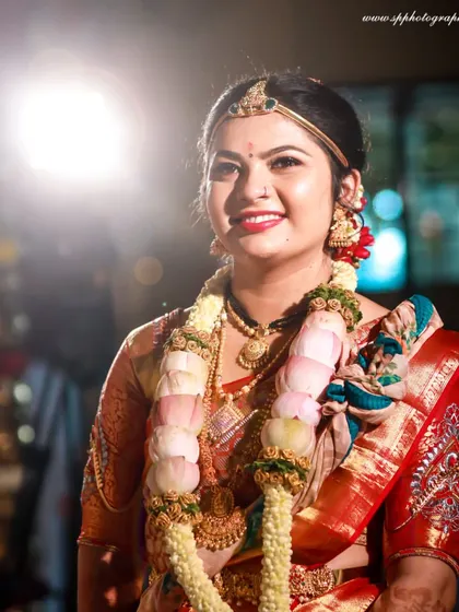 A classic bridal portrait with beautiful backlighting. This technique creates a soft glow around the bride, highlighting her features and creating a dreamy effect.