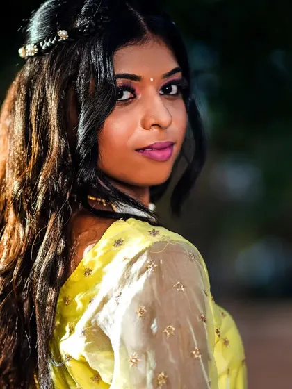 A beautiful portrait shot in our yellow gown, perfect for capturing a soft and romantic look. The sheer sleeves add a touch of elegance.