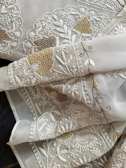 A detail shot of the sleeve, showing the beautiful border embroidery.