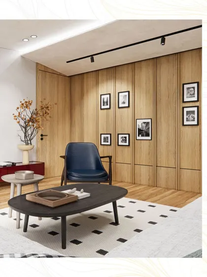 A quiet reading corner in the penthouse, with a classic blue leather armchair set against a backdrop of wood-paneled walls and a gallery of family photos.