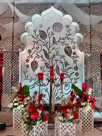A detail shot of the side panels, featuring delicate tree-of-life motifs and elegant candelabras, adding a layer of traditional artistry.