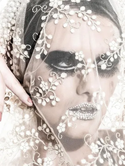 Another angle of the detailed beauty shot. The black and white treatment emphasizes the texture of the lace and the dramatic eye makeup.
