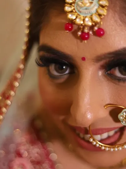 A close-up shot capturing the bride's expressive eyes and beautiful smile.