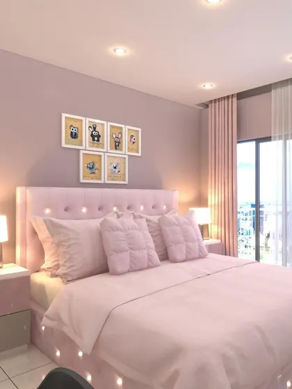 The bed area of the pink-themed daughter's room, showing a plush pink bed with a tufted headboard and matching side tables.