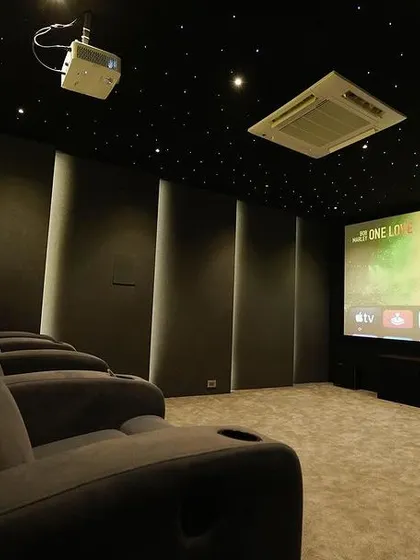 A duplicate of 139, this image also captures the immersive feel of this Chennai home theater, with the large screen and comfortable seating creating a perfect private cinema.