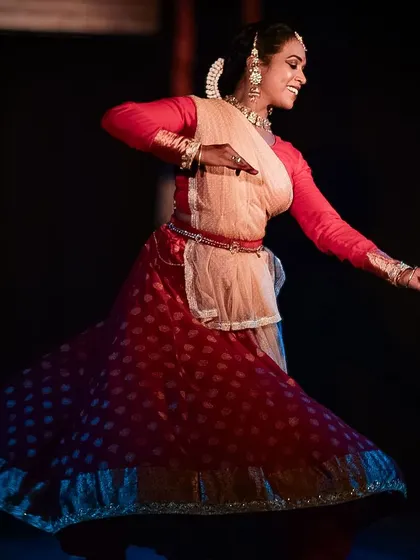The dancer's smile shines through even during a fast paced, energetic sequence.