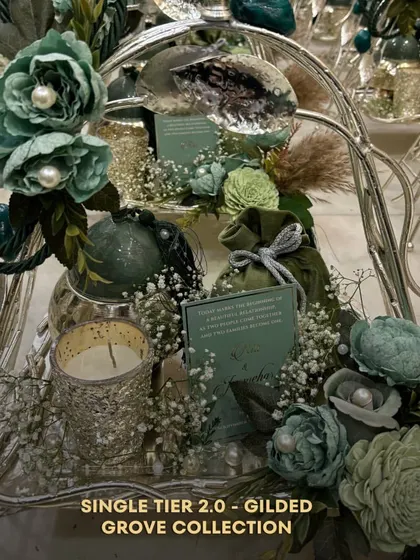 A detailed look at the Single Tier 2.0 from the Gilded Grove Collection. This hamper includes a scented candle, a velvet potli, and a personalized note, making it a complete and thoughtful gift.