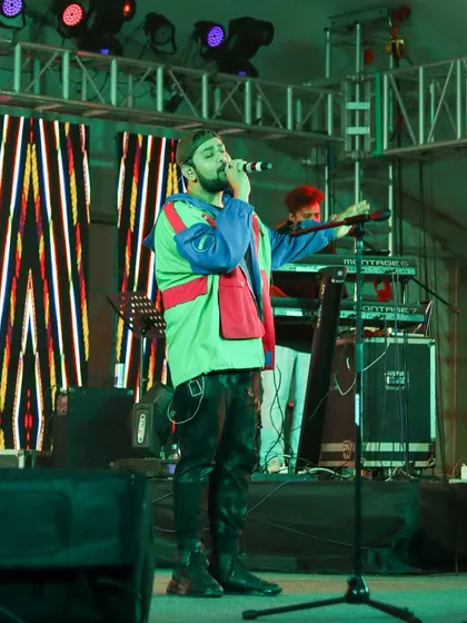 A full view of Shashwat Singh and his keyboardist on stage, highlighting the live band setup we provide.