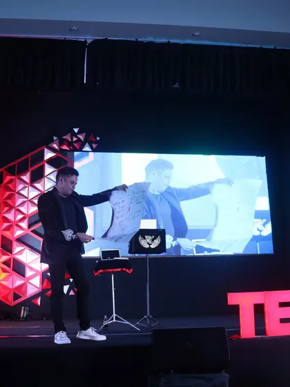 A picture-in-picture view of my performance at TEDxNitte. The live feed on the screen allows everyone in the auditorium to see the details of the mind-reading experiment.