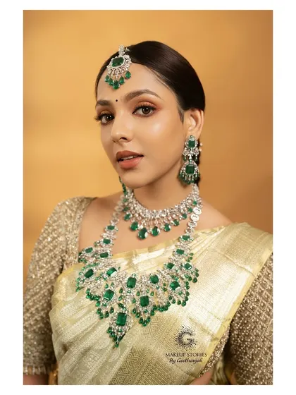 A classic South Indian bridal look taught in my professional makeup course. This portrait demonstrates how to balance bold emerald jewelry with soft, glowing makeup for a divine result.