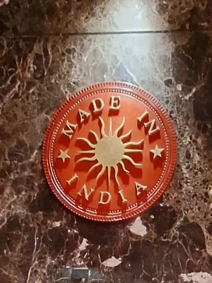 The "Made In India" logo embossed in marble. A touch of branding that reflects the restaurant's commitment to quality.