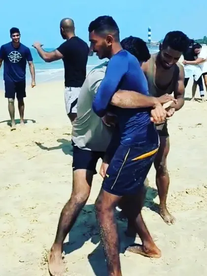 Practicing stand-up grappling and takedown defense on the Udupi coast. The shifting sand makes every movement a test of balance and control, translating directly to better performance and body awareness in any combat sport.