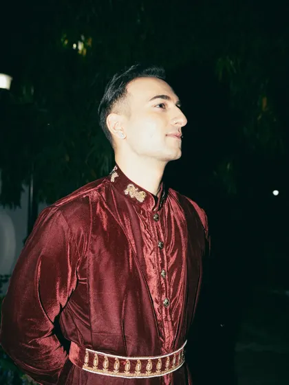 The 'Duke of Delhi' look in a rich, maroon velvet outfit.