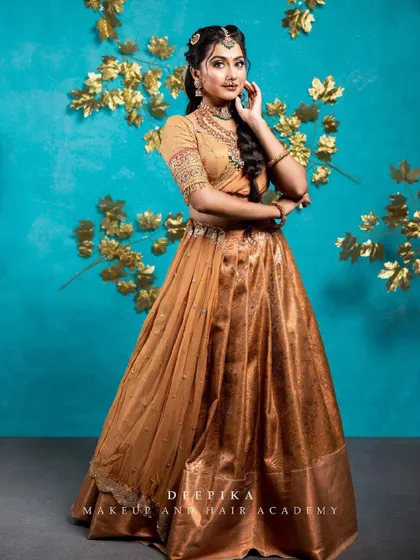 A full-length view of this beautiful Langa Voni. The traditional braid and temple jewelry complete this classic South Indian look.
