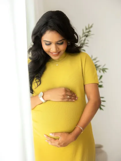 The gentle connection between a mother and her unborn baby. This close-up shot in the studio captures the soft details and the quiet love that fills these moments.