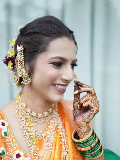 A candid close-up of the bride, capturing a natural, joyful laugh.