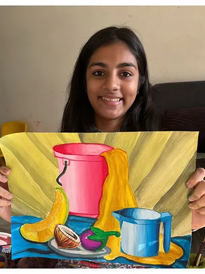 An intermediate grade exam student with her still life painting. Her work demonstrates a strong ability to handle composition and colour.