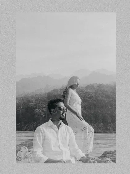 An artistic black and white double exposure from a Rishikesh pre-wedding shoot, blending the couple's portraits with the mountain scenery.