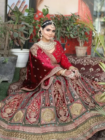 A full view of the royal velvet bridal lehenga, showcasing its grand skirt and luxurious feel. Perfect for a winter wedding.