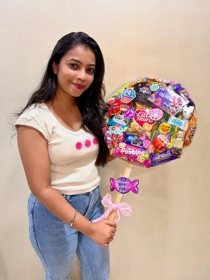 Here I am with another lollipop hamper, ready to be sent to its new home. I love how the colors and treats come together to create a little bundle of joy.