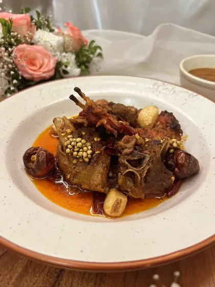 For the true meat lover, I present the Rajasthani Junglee Maas. This is a rustic and spicy dry lamb dish, slow-cooked in A2 cow ghee with confit garlic and boriya chili for a deep, authentic flavor.