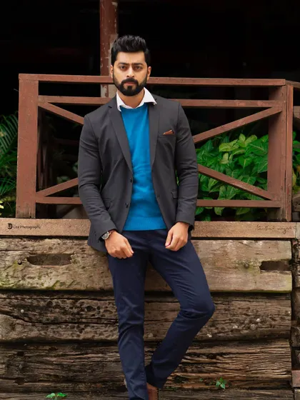 A full-length portrait of Tarak Ponnappa, showing his complete outfit and confident stance. This type of shot is crucial for lookbooks and casting purposes.