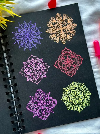 A collection of six different mini mandala patterns, each in a different vibrant color. This shows the variety of small motifs you can learn to create.