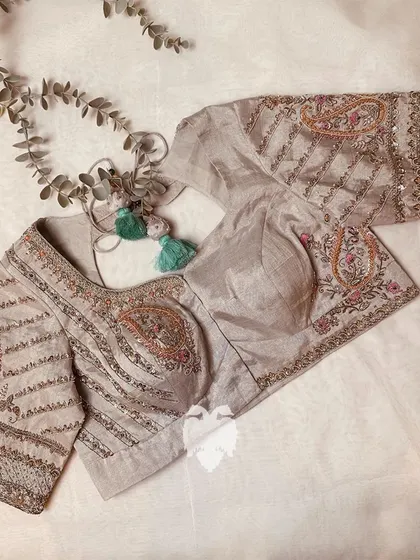 A silver tissue silk blouse with exquisite paisley motifs and geometric lines.