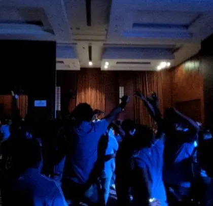 A wide shot of the banquet hall during the Kannada-themed corporate event.