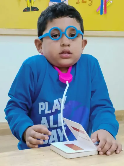 A future doctor is ready for his patients. Role-playing activities like this help children understand different professions and their importance in our community.