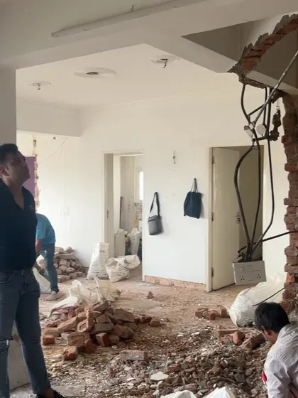 Supervising the demolition work for an apartment renovation. This is the first step in completely reimagining the space according to the new design.