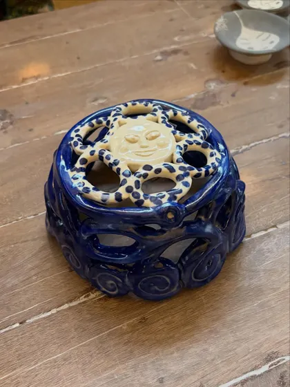 This student's quiet patience and steady curiosity shine through in these beautiful pieces from her beginner's course. The whimsical koi pond platter is a favorite, full of texture and calm joy.